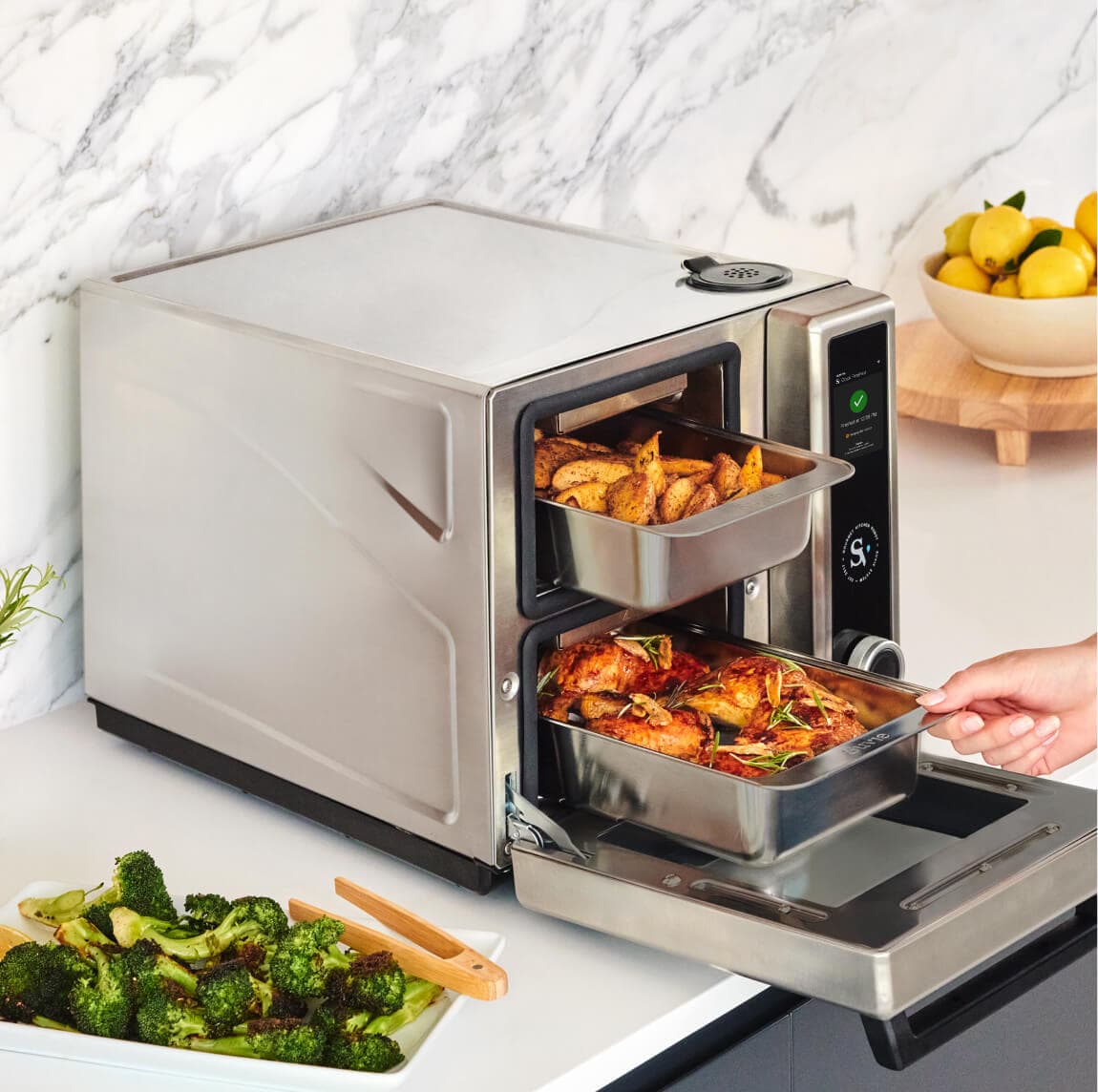 Suvie Kitchen Robot with the door open, showing food ready to cook