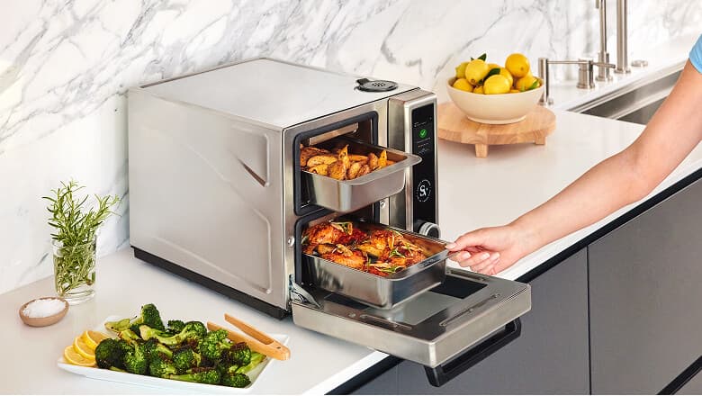 Suvie Kitchen Robot with the door open, showing food ready to cook